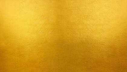 Gold wall texture background. Yellow shiny gold foil paint on wall sheet with gloss light reflection, vibrant golden paper luxury wallpaper
