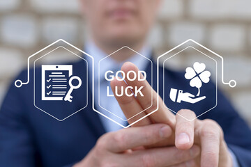 Man working on virtual touch screen presses inscription: GOOD LUCK. Good luck, fortune, success,...