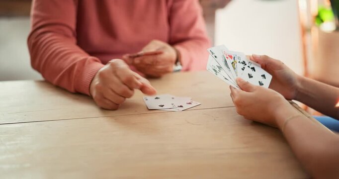Nursing home, hands and playing cards by nurse and elderly man for dementia, memory loss or gambling. Senior care, poker and old patient with homecare worker for Alzheimer, cognitive or assessment
