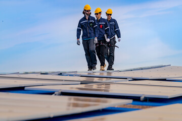 engineer man inspects construction of solar cell panel or photovoltaic cell by electronic device....