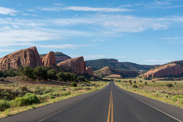 Desert highway with red rock formations
