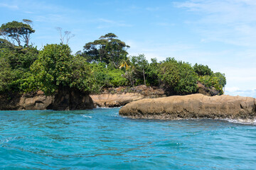 Stunning Tropical Island with Crystal Clear Water, Lush Vegetation, and Palm Trees - Serene Paradise Beach in the Caribbean, Perfect for Eco Tourism, Summer Vacations, and Exotic Travel Destinations