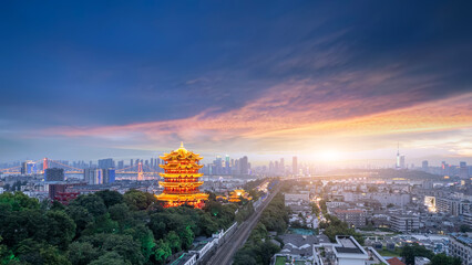 Majestic Sunset Over Urban Landscape Featuring Traditional Pavilion