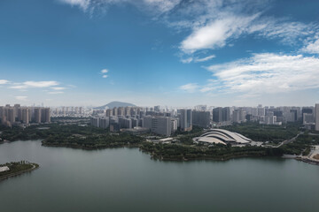 Fototapeta premium Stunning Aerial View of Modern Urban Landscape and Serene Water