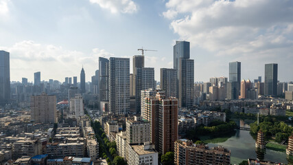 Vibrant Urban Skyline Overlooking a Serene River Landscape