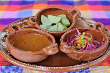 Hot sauce, red onion habanero chile and lemons for traditional mexican food