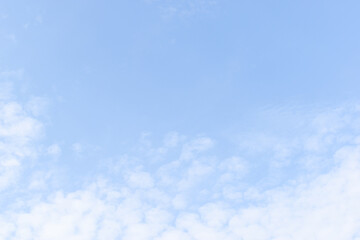 beautiful blue sky and white fluffy group of clouds with sunrise in the morning, natural background