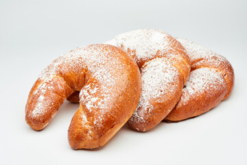 Fluffy crescent rolls filled with jam and dusted with powdered sugar, perfect for a sweet treat