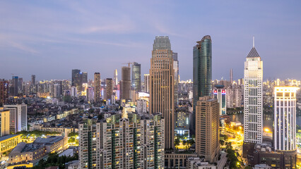 Vibrant City Skyline at Dusk with Modern Architecture and Illuminated Streets
