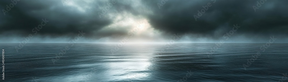 Poster mysterious seascape with dark clouds and calm waters reflecting soft light, creating a serene and dr
