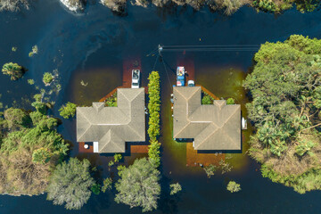 Aftermath of natural disaster. Surrounded by hurricane Ian rainfall flood waters homes in Florida...