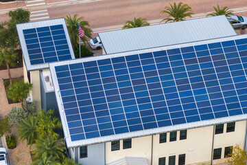 Autonomous building in Florida with photovoltaic rooftop covered with solar panels for producing of...