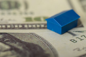 The image illustrates the connection between real estate and financial value, highlighting the role of property investment in building wealth.