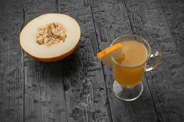 Fresh Melon Drink with Slice on Rustic Wooden Table