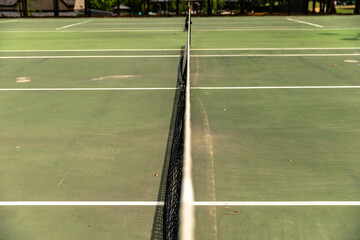 Fototapeta premium Close-up of tennis net on tennis court, selective focus, background.