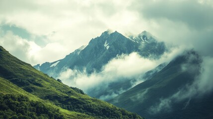 Fototapeta premium Majestic Mountain Peak Hidden in Clouds