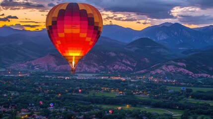 Fototapeta premium Evening Hot Air Balloon Ride: Experience a sunset hot air balloon ride. Witness the sky’s colors change and the landscape below become a magical sea of twinkling lights. 