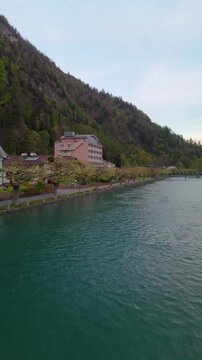  Aar river Interlaken Switzerland alps drone aerial side reveal cloudy day Vertical