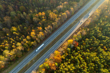 USA highway transportation infrastructure in North Carolina Appalachian mountains. American freeway road with fast driving semi trucks