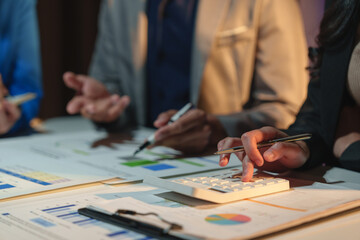 Group of business people brainstorming in analytical plan meeting Calculate the numbers obtained...