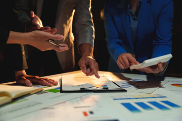 Group of business people brainstorming in analytical plan meeting Calculate the numbers obtained from the graph. Financial growth chart. Marketing. Concept of business success statistics.