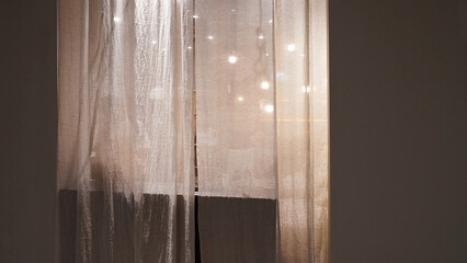 Soft Glow Behind Sheer Curtains in a Teenage Girl's Room