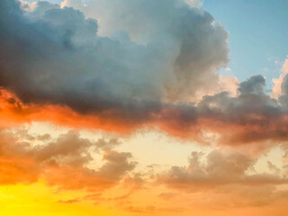 Blue yellow and gold gradient sky with clouds 