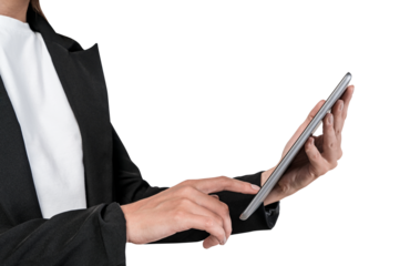 A business person in formal attire using a tablet. The image is on a white background, indicating a technology or business concept