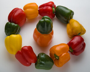 Group of dancing peppers in a circle