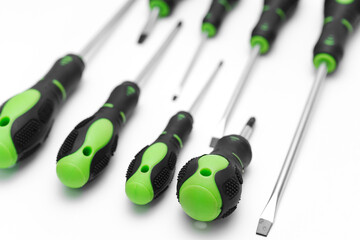 green plastic screwdriver handles on a white background. 