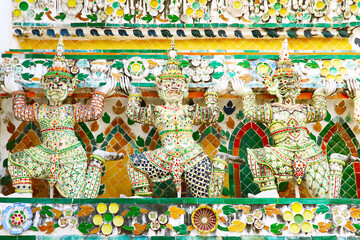 Fantastic Architectural Details of Wat Arun Main Prang with Rows of Mythical Yaksha Demon Sculptures and Pieces of Chinese Porcelain, Bangkok, Thailand