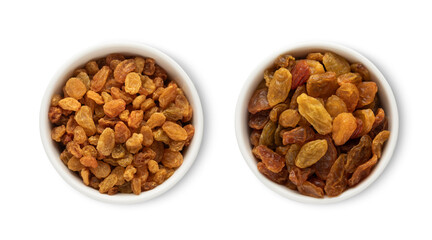 Bowl plates with sweet healthy raisins made from green grapes isolated on white background.Top view.