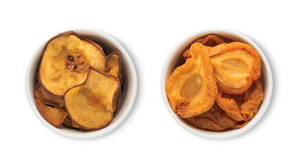 Bowl plates with dried sweet organic pear pieces isolated on white background.Top view.