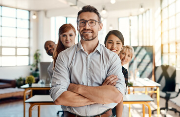 Portrait, group and people with confidence in office for collaboration, leadership or about us of partnership. Smile, diversity and arms crossed for teamwork, career opportunity or support of company