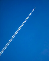 Dramatic contrail with texture from a jet in a diagonal moving from ower left to upper right...
