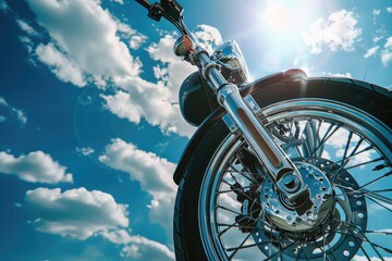 A close-up shot of a motorcycle tire with the sun shining in the background