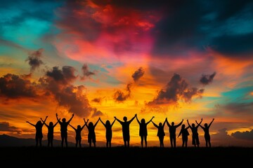 A group of friends standing in silhouette against the sky at sunset, arms outstretched, conveying a sense of friendship and togetherness.
