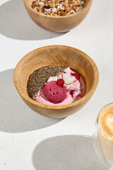 Raspberry Smoothie Bowl with Chia Seeds, Coconut, and Raspberry Sorbet in Wooden Bowl – Healthy Breakfast Concept