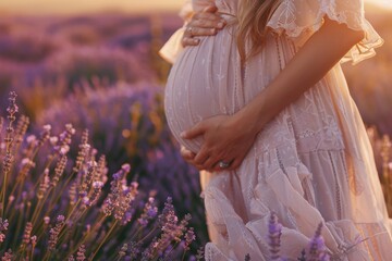 A expecting mother stands amidst purple blooms, ideal for maternity or nature-themed projects