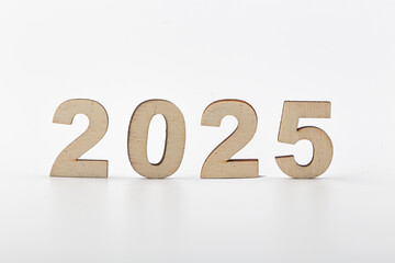 Wooden block 2025 text on table background.