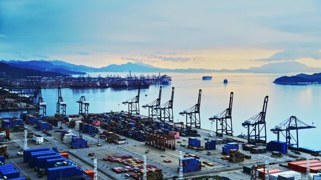 Time lapse of containers in a harbor at sunrise