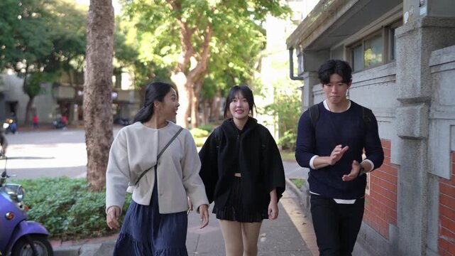 In Da'an District, Taipei, a slow-motion video captures two women in their twenties, one Taiwanese and the other South Asian, walking and chatting amiably on a street near a university.