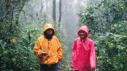 Father and daughter hiking exploring a lush forest