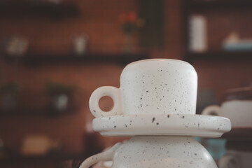 Selective focus unused clean white ceramic cups lay upside down at coffee shop