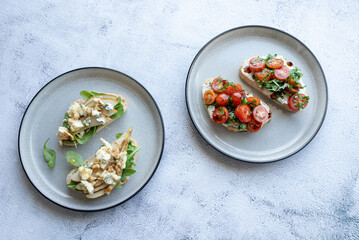 Bruschetta set on plate on grey background. Close up. Place for text-