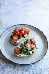 Bruschetta set on plate on grey background. Close up. Place for text-
