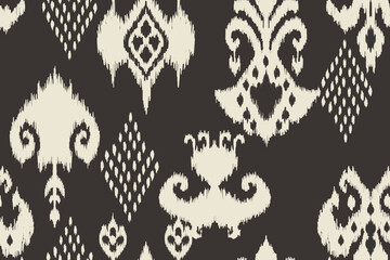 Ikat paisley embroidery on the fabric in Indonesia,India and asian countries.geometric ethnic oriental seamless pattern.Aztec style. illustration.design for texture,fabric,clothing,wrapping,carpet © Manu