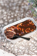 chocolate cake with cashew nuts in a tray