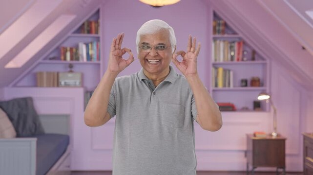 Indian old man showing okay sign