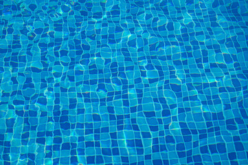 Texture of water in swimming pool for background